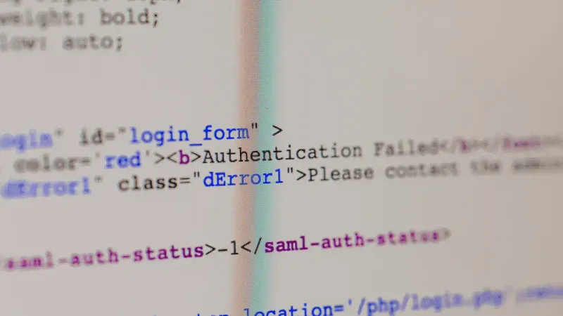 Picture of a computer screen showing HTML code to represent I.T work.